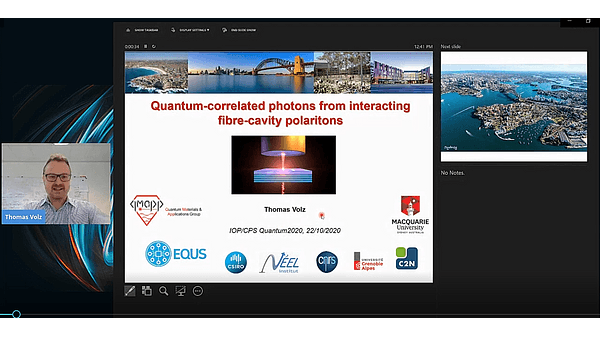 Quantum-correlated photons from interacting fibre-cavity polaritons